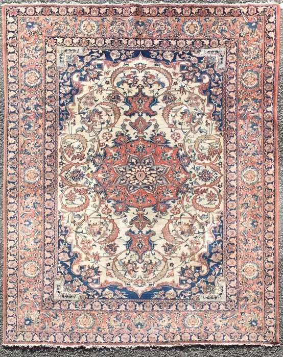 Lot 71 - A hand woven Isfahan rug with central floral...