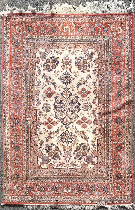 Lot 73 - A large Persian Tabriz style carpet with...