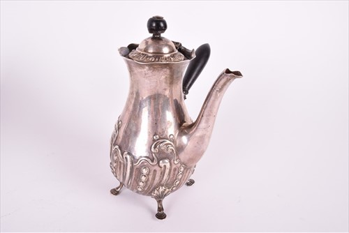 Lot 466 - A Georgian silver teapotÂ with later embossed...
