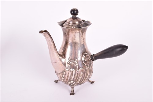 Lot 466 - A Georgian silver teapotÂ with later embossed...