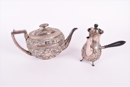 Lot 466 - A Georgian silver teapotÂ with later embossed...