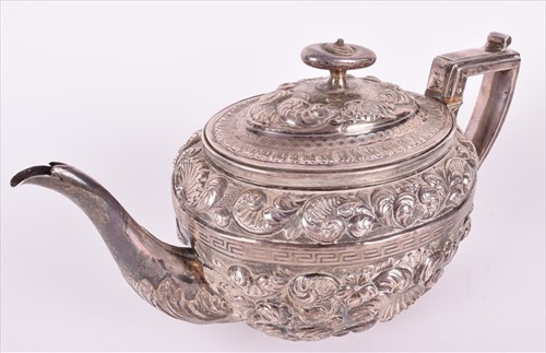 Lot 466 - A Georgian silver teapotÂ with later embossed...