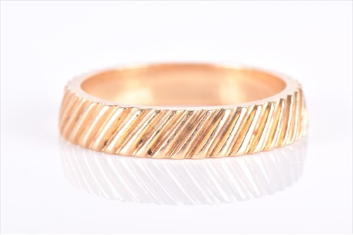 Lot 682 - Kutchinsky. An 18ct yellow gold eternity band...