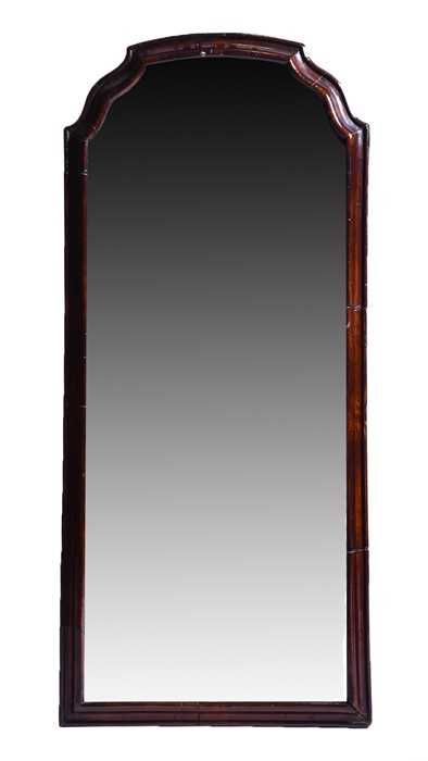 Lot 65 - A Queen Anne walnut mirror with moulded border...