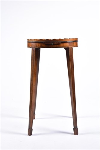 Lot 61 - A small George III oval wine table with wave...