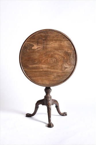 Lot 55 - A Georgian mahogany tilt-top table with...