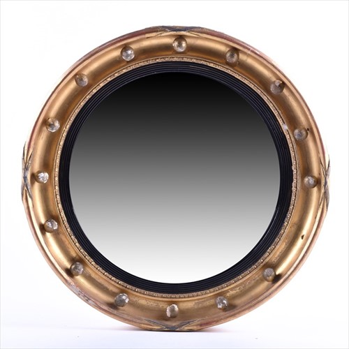 Lot 64 - A Victorian Regency style convex mirror of...