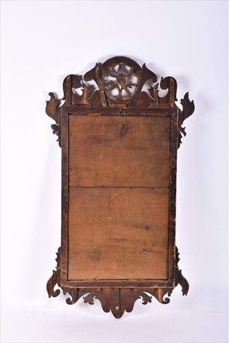 Lot 67 - A late Georgian mahogany fret mirror designed...