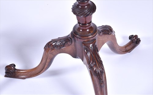 Lot 57 - A Victorian carved mahogany tripod side table...