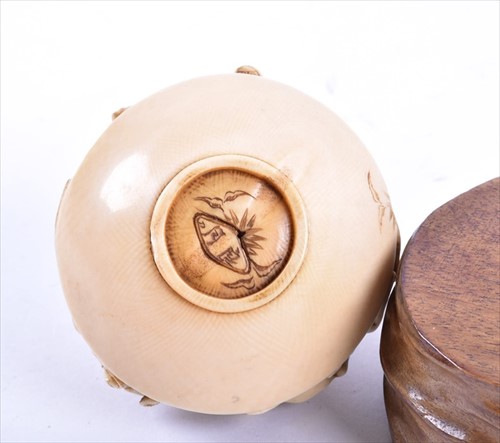 Lot 252 - A Japanese Meiji period carved ivory netsuke...