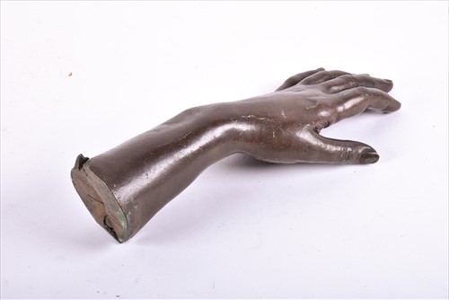 Lot 304 - A 19th century cast patinated bronze hand and...