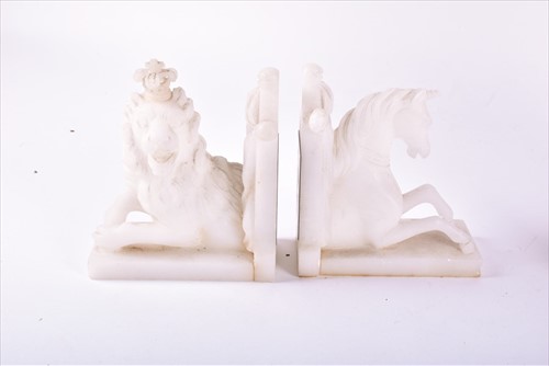Lot 351 - A pair of alabaster bookends in the form of...