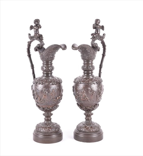 Lot 268 - A pair of bronze Neoclassical style ewers...