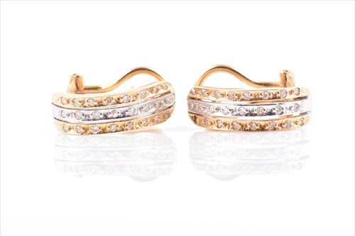 Lot 679 - A pair of 18ct yellow and white gold earrings...