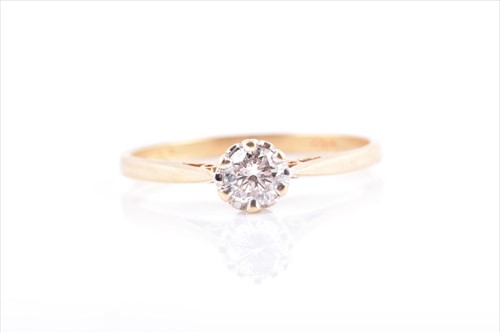 Lot 676 - An 18ct yellow gold and solitaire diamond ring...