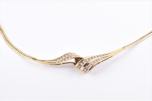 Lot 674 - A 9ct yellow gold and diamond necklace the...