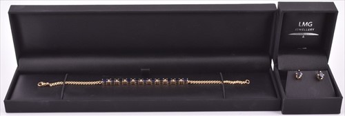 Lot 673 - An 18ct yellow gold, diamond, and sapphire...
