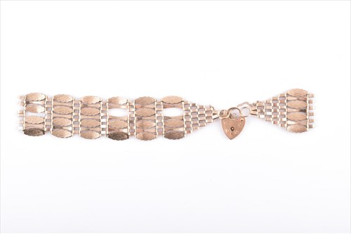 Lot 669 - A 9ct yellow gold fancy gate-link bracelet...