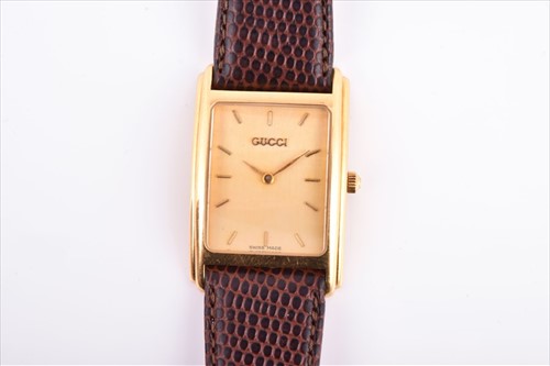 Lot 331 - A Gucci 18ct yellow gold quartz wristwatch the...