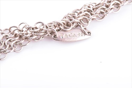 Lot 638 - Tiffany & Co. A silver mesh bib necklace with...