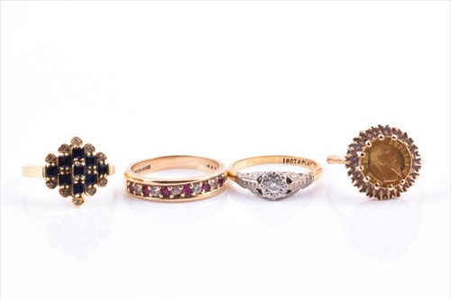 Lot 645 - A yellow metal and sapphire ring size M,...
