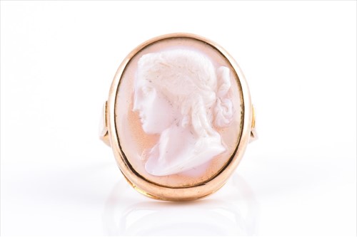 Lot 656 - A yellow metal and onyx cameo ring set with a...