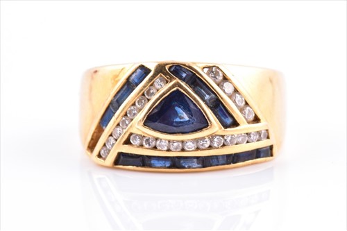 Lot 662 - A yellow metal, diamond, and sapphire ring set...