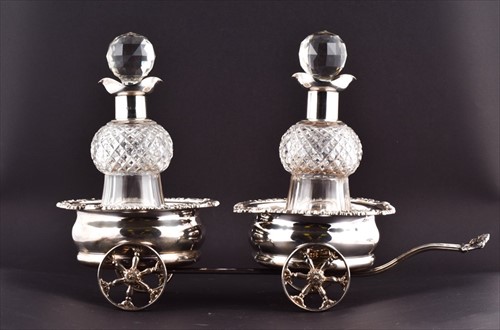 Lot 453 - An Elizabeth II silver decanter wagon London...