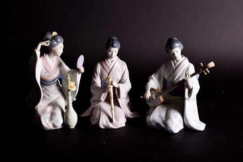 Lot 244 - A small group of Lladro porcelain geisha...