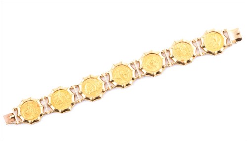 Lot 589 - An 18ct gold articulated bracelet containing...