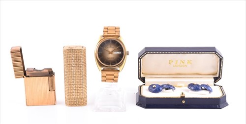 Lot 584 - An 18ct yellow gold cased lighter together...