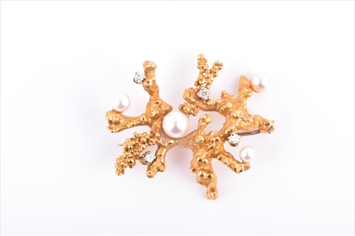 Lot 575 - A yellow metal, diamond, and pearl brooch in...