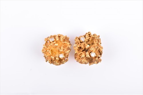Lot 585 - A pair of yellow metal and diamond earrings...