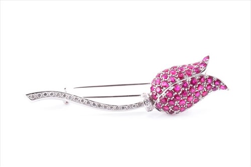 Lot 567 - An 18ct white gold, diamond, and ruby floral...