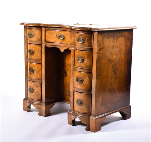 Lot 142 - A 19th century walnut serpentine fronted...