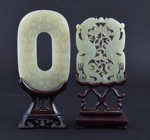 Lot 116 - A Chinese carved celadon jade plaque on a...