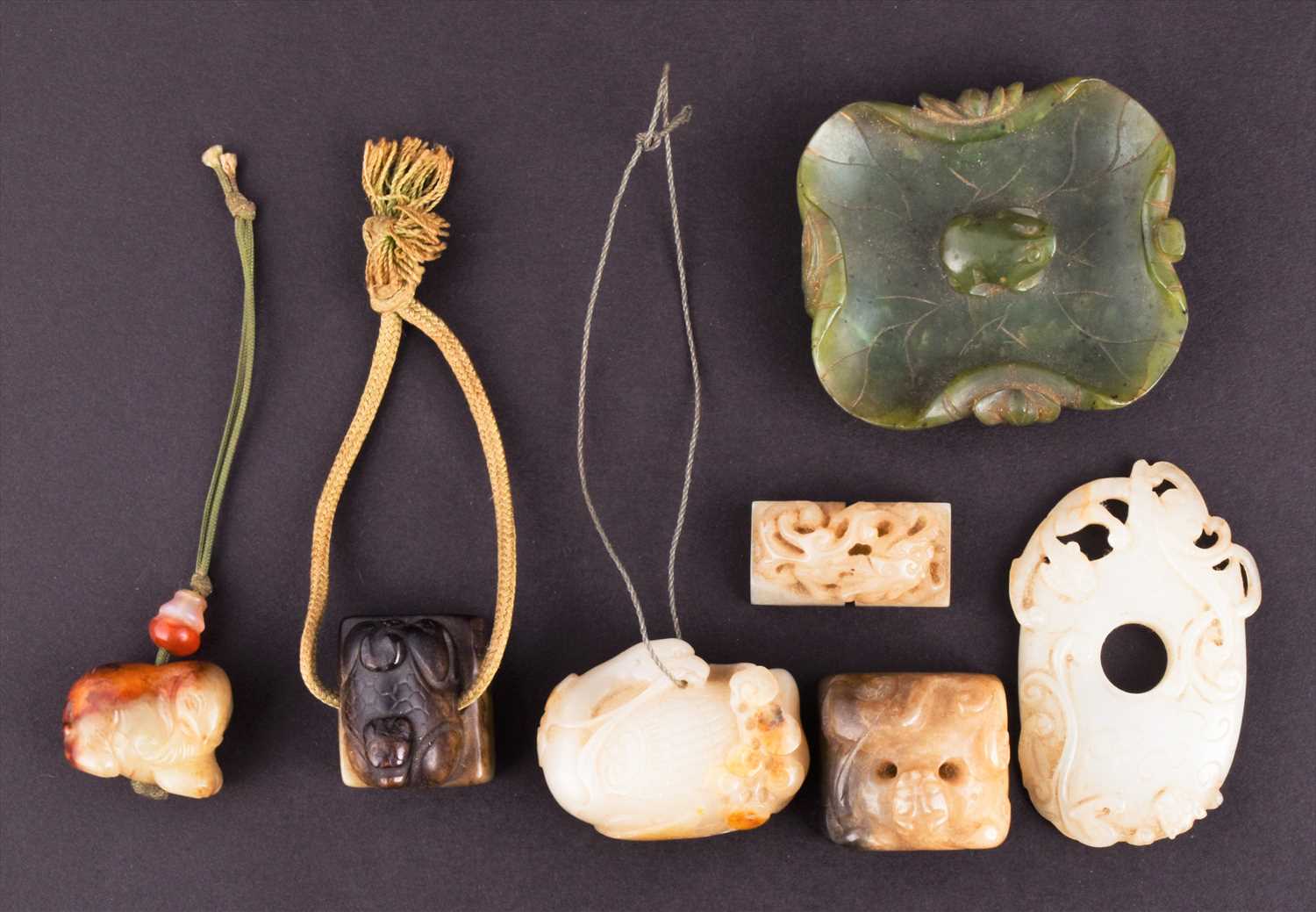 Lot 119 - Seven small items of carved Chinese jade...