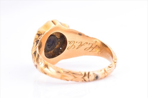Lot 508 - A yellow metal and enamel mourning ring...