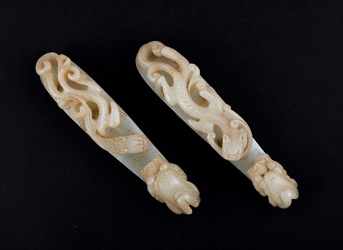 Lot 120 - Two Chinese celadon jade belt buckles each...