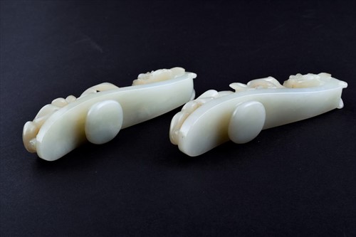 Lot 120 - Two Chinese celadon jade belt buckles each...