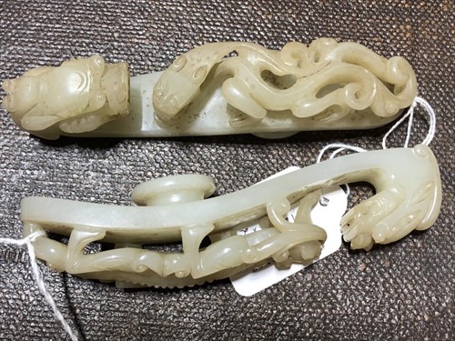 Lot 120 - Two Chinese celadon jade belt buckles each...