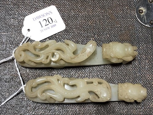 Lot 120 - Two Chinese celadon jade belt buckles each...