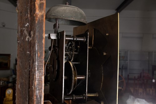 Lot 299 - A 19th century pine longcase clock the brass...