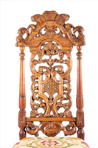 Lot 89 - A 17th century style carved and pierced back...