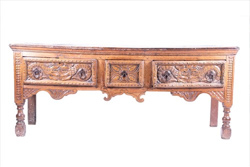 Lot 119 - A 17th century oak dresser base with carved...