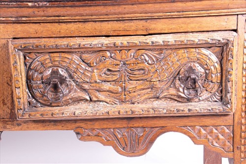 Lot 119 - A 17th century oak dresser base with carved...