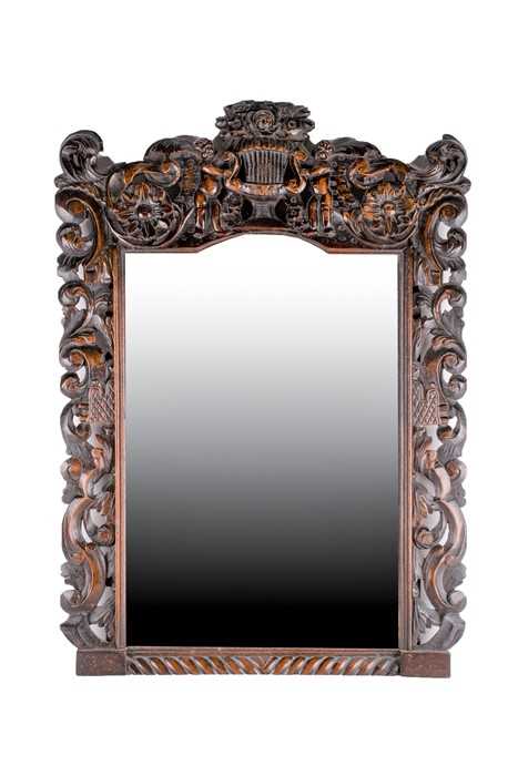 Lot 123 - A 19th century oak carved mirror with figural...