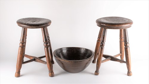 Lot 216 - A near pair of provincial oak stools each on...