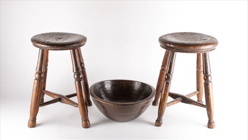 Lot 216 - A near pair of provincial oak stools each on...
