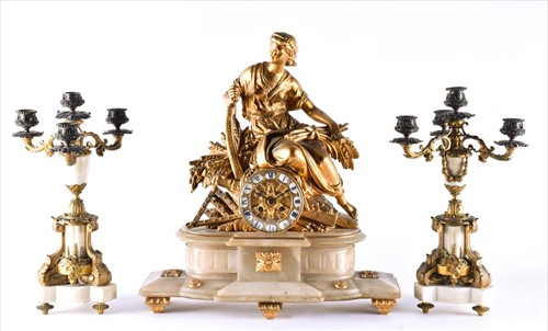 Lot 295 - A 19th century gilt metal clock garniture with...